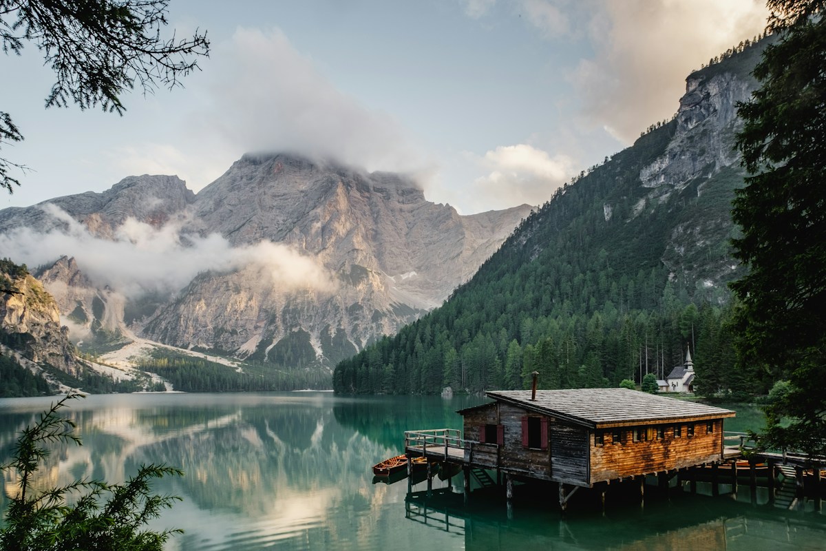 Alpine lake surrounded by mountains and forest